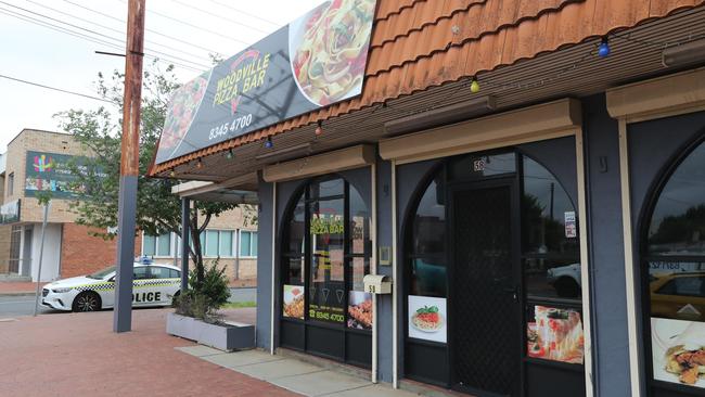 Police outside the Woodville Pizza Bar last month. Picture: Tait Schmaal