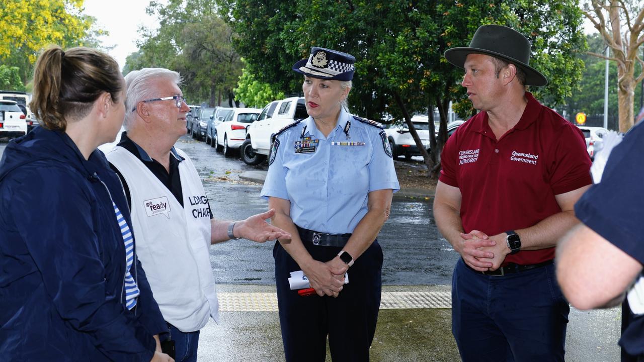 Cairns Mayor Terry James briefs Queensland Police Commissioner Katarina Carroll and Deputy Premier Steven Miles on the impact of Tropical Cyclone Jasper at the Cairns Local Disaster Coordination Centre. Picture: Brendan Radke