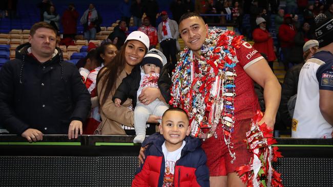 Siosiua Taukeiaho of Tonga poses for a photo alongside his family following the Rugby League World Cup Quarter Final match between Tonga and Samoa. (Photo by Jan Kruger/Getty Images for RLWC)