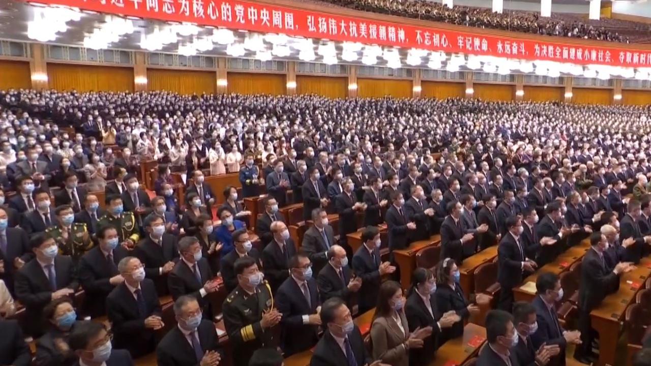 In a show of unity and power, Xi addressed a large crown who enthusiastically applauded him.