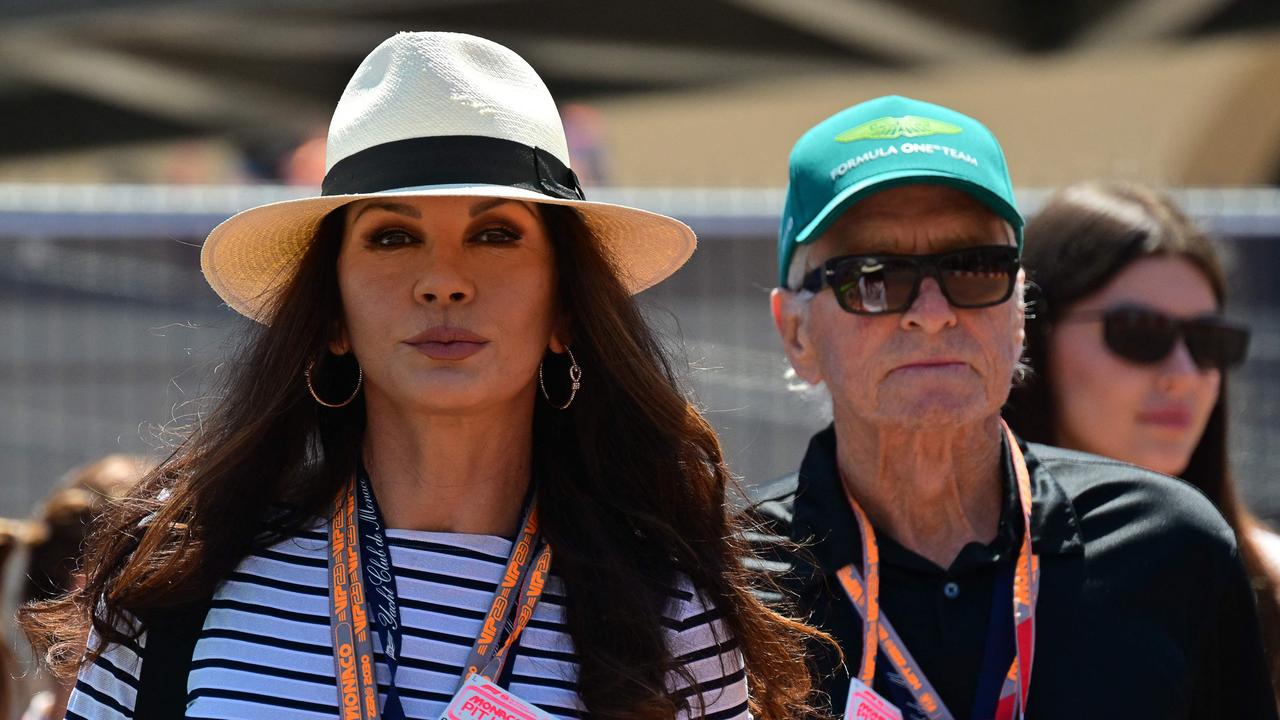 Pure class from Catherine Zeta-Jones and Martin Brundle. (Photo by ANDREJ ISAKOVIC / AFP)