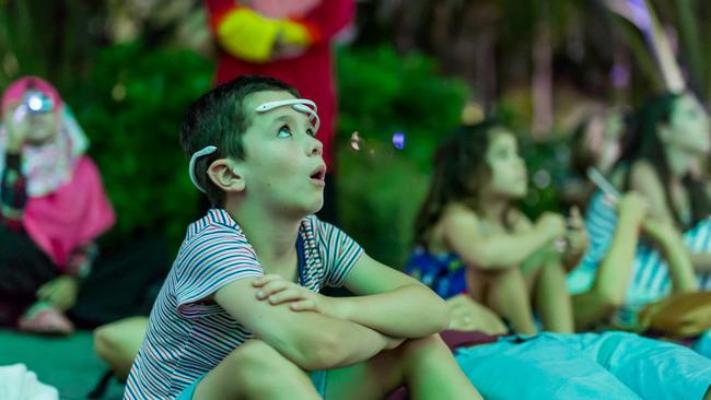 Paddy Duffy wearing EEG headset while watching the Gardens by the Bay light show.