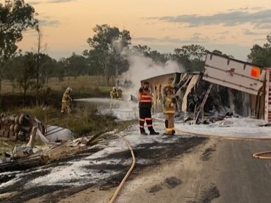 Firefighters at the scene of truck crash that sparked a grass fire on the Bruce Highway north of Gympie on Tuesday afternoon. Photo: Contributed