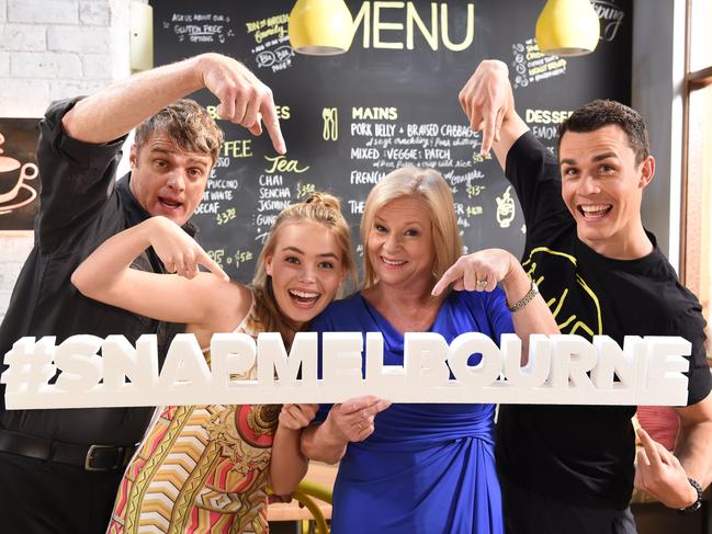 Neighbours cast on set at Freemantle Media Studios in Nunawading holding a #SnapMelbourne sign. Cast, Damien Richardson,Lilly Van der Meer,Colette Mann, and Andrew Morley in the Harold's Cafe set. Picture: Lawrence Pinder