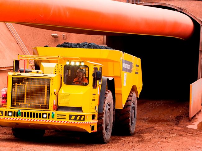 The first truck load of ore is hauled from the Lady Loretta mine north of Mount Isa