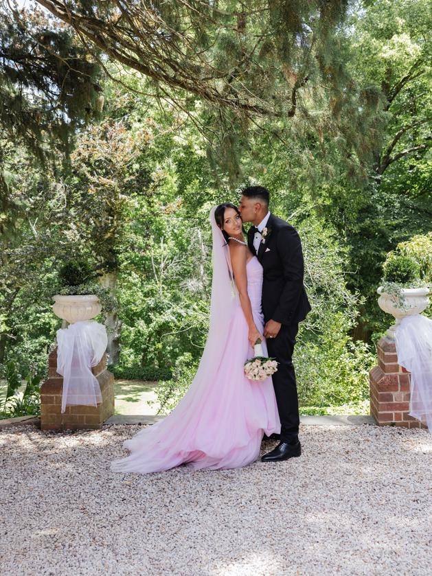 Poppy wearing her pastel pink ceremony gown. Picture: Christina Toulantas