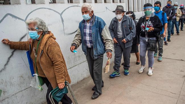 Peruvians wait for their dose of the Pfizer-BioNTech vaccine in Lima. Picture: AFP