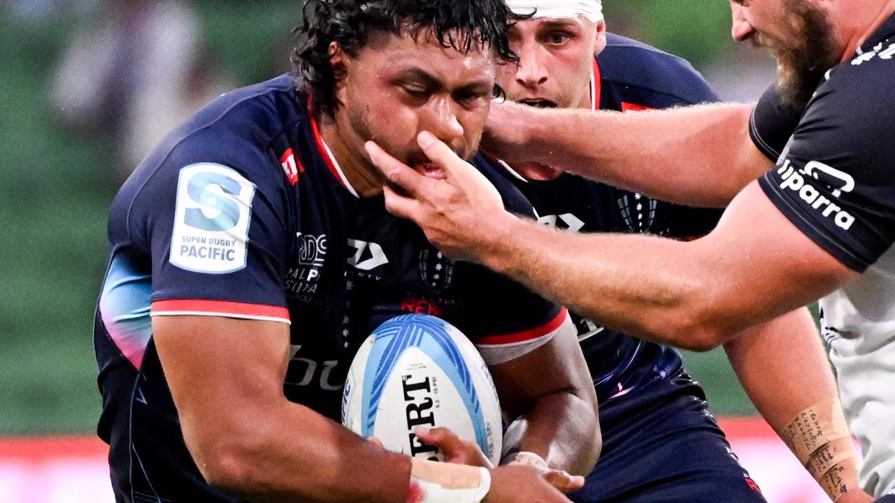 Rebels' Rob Leota (L) is tackled by Brumbies' James Slipper (Photo by William WEST / AFP