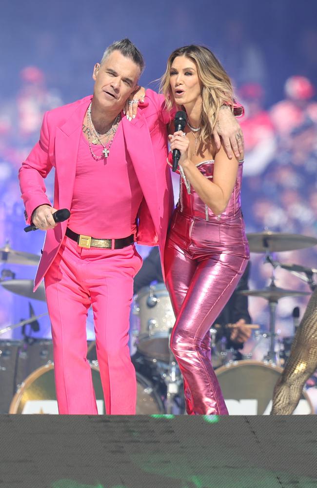 Robbie Williams performing together for the packed MCG. Picture: David Caird