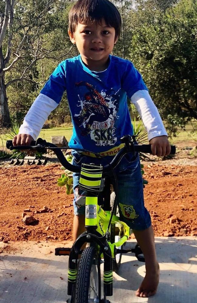 Jett Roberts, 5, with his beloved bright yellow Colorado bike. Photo: Ming Roberts