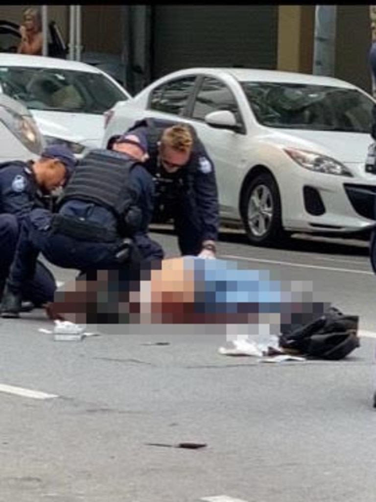 Emergency services work on the man shot dead in the Brisbane CBD. Picture: Supplied