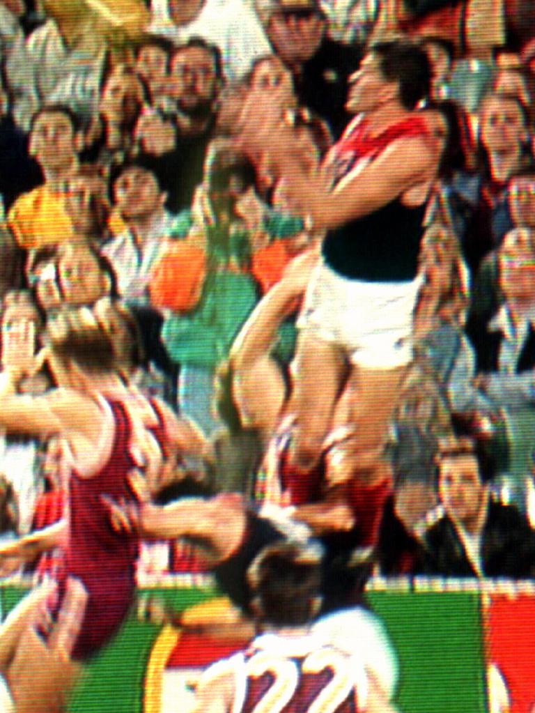 Smith takes his famous grab over Richard Champion and Garry Lyon.