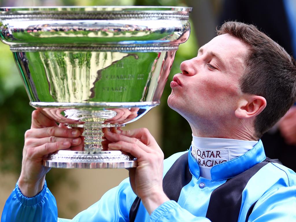 Oisin Murphy (riding Asfoora) kisses the trophy after winning the King Charles III Stakes during Royal Ascot 2024 at Ascot Racecourse. Picture: Bryn Lennon/Getty Images