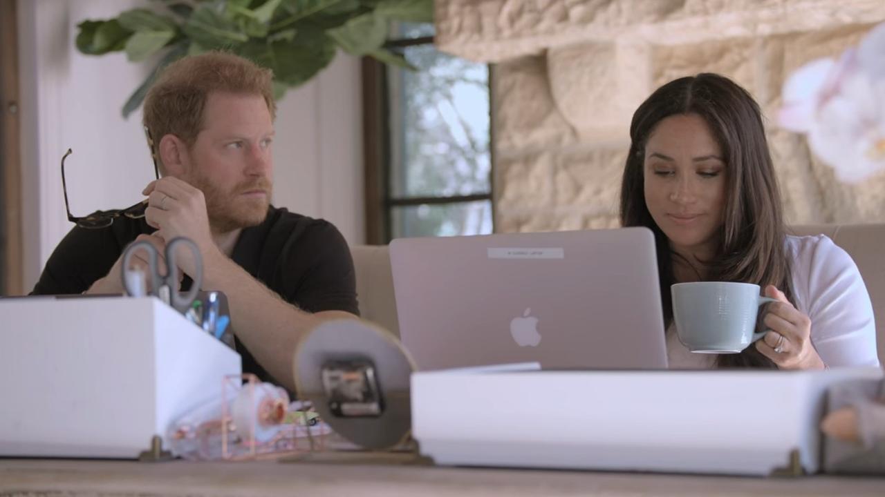 Harry and Meghan seen working away in their Netflix docuseries. Picture: Netflix