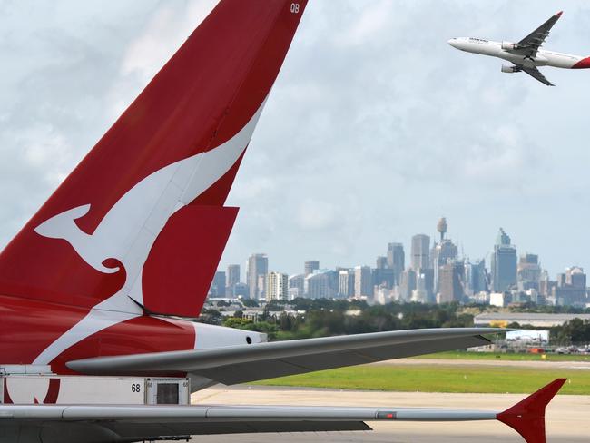 "Sydney, Australia - March, 14th 2012: Quantas aeroplanes and tail fin with the distant view of downtown Sydney - Sydney Airport". Picture: iStock