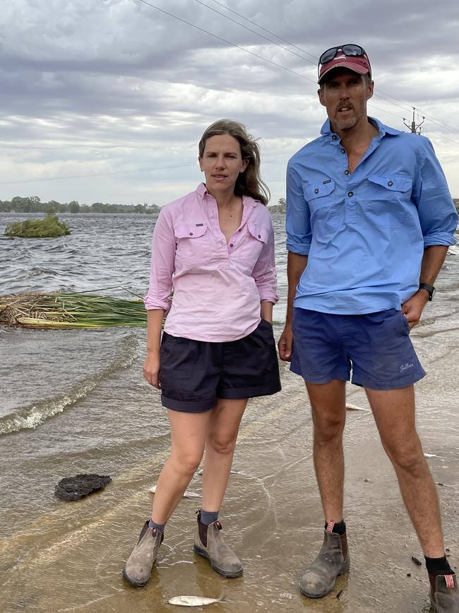 Alex and Mark Westlake inspect their flooded farm earlier this year. Photo: Dylan Hogarth.