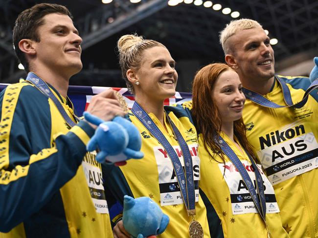 Gold medallists Australia pose during the medals ceremony for the mixed 4x100m freestyle relay swimming event during the World Aquatics Championships in Fukuoka on July 29, 2023. (Photo by Philip FONG / AFP)