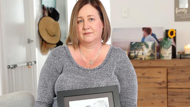 Mia Bannister at home with pictures of her late son Oliver Hughes, 14. Picture: Liam Kidston