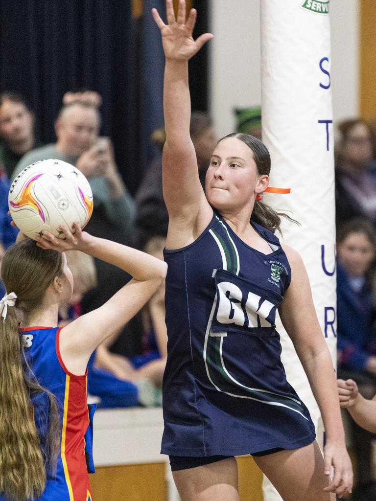 Emma Cavanagh defends for St Ursula's Junior B against Downlands Junior B in Merici-Chevalier Cup netball at Salo Centre, Friday, July 19, 2024. Picture: Kevin Farmer