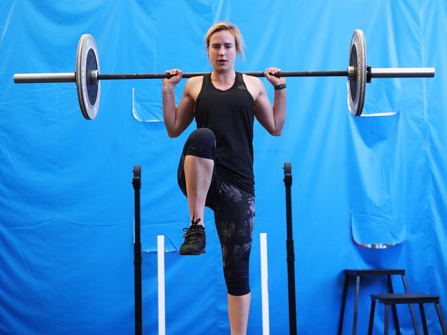 Ellyse Perry does some weight training. Picture: Phil Hillyard