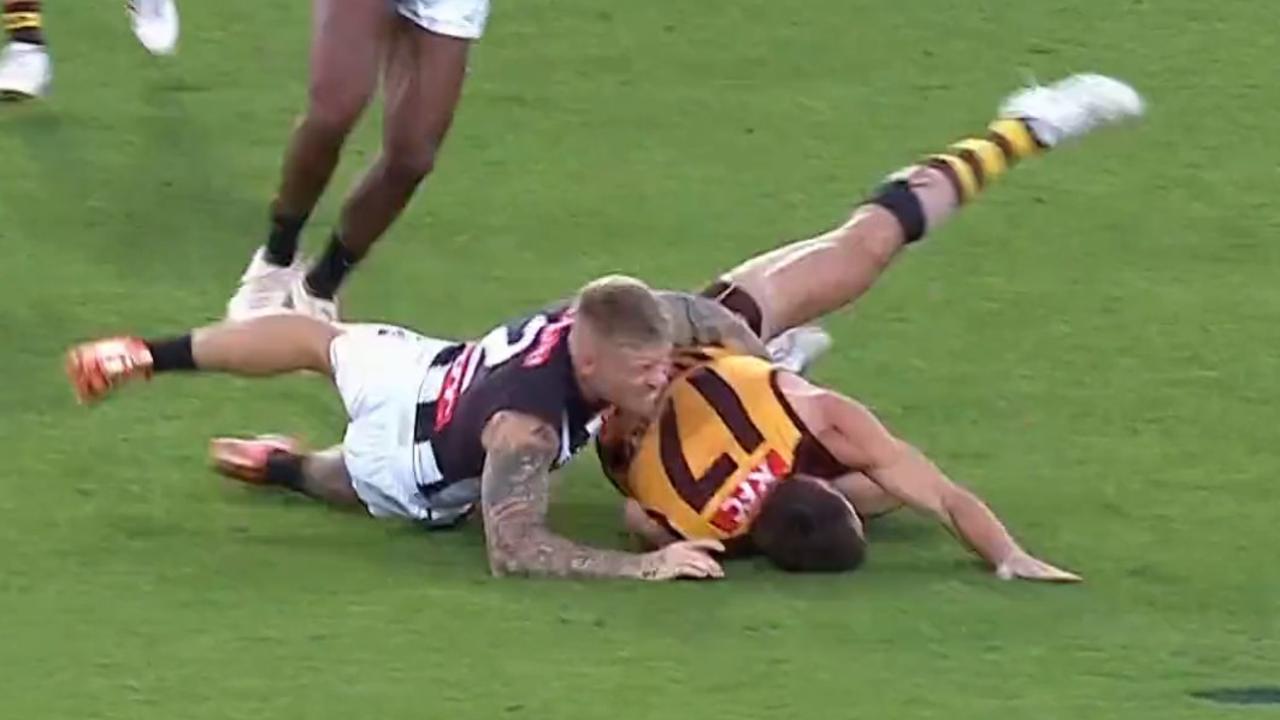 Jordan De Goey lays a tackle on Lloyd Meek.