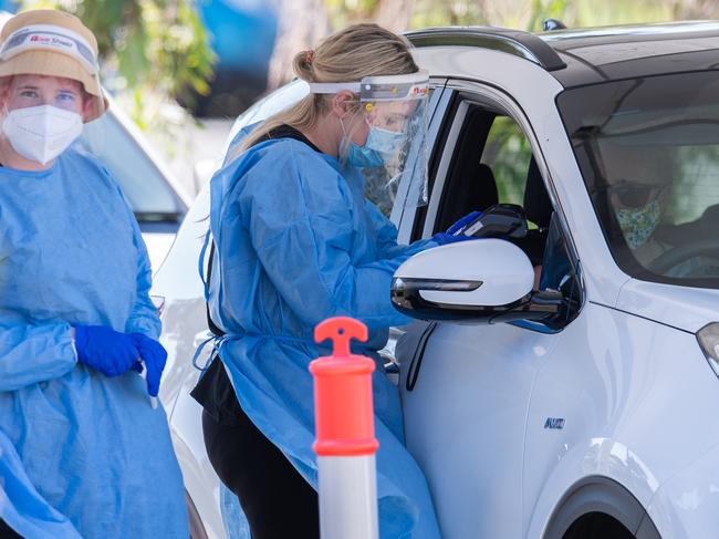 BRISBANE, AUSTRALIA - NewsWire Photos - OCTOBER 5, 2021.Health workers process a member of the public at a drive through Covid-19 clinic in Brisbane. Picture: NCA NewsWire / Dan Peled