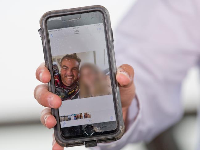 Member for Whitsunday Jason Costigan shows media a selfie taken with the 18-year-old woman who claims he harassed her.