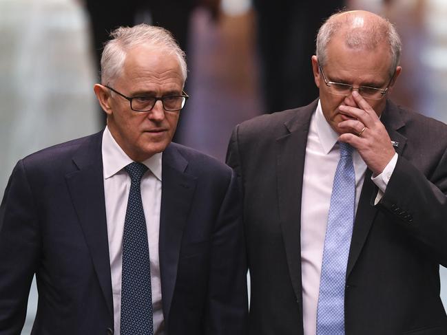 Australian Prime Minister Malcolm Turnbull (left) and Australian Treasurer Scott Morrison arrive for a vote to adjourn the House of Representatives at Parliament House in Canberra, Thursday, August 23, 2018.  (AAP Image/Lukas Coch) NO ARCHIVING