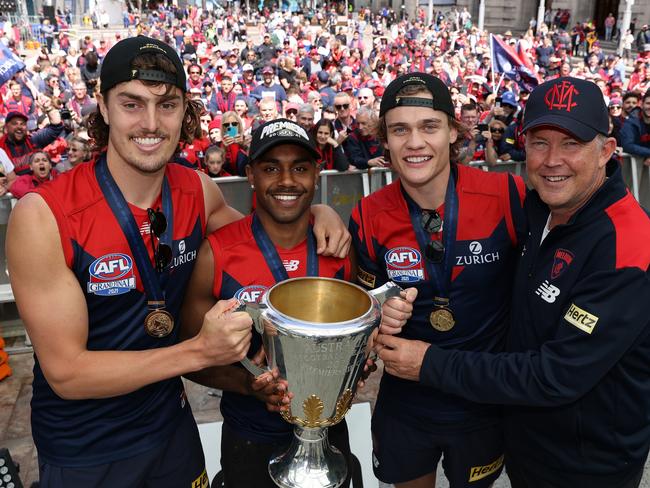 Luke Jackson, posing alongside Kysaiah Pickett, Trent Rivers and Gary Pert, won a flag at the Demons. Picture: Paul Kane/Getty Images.