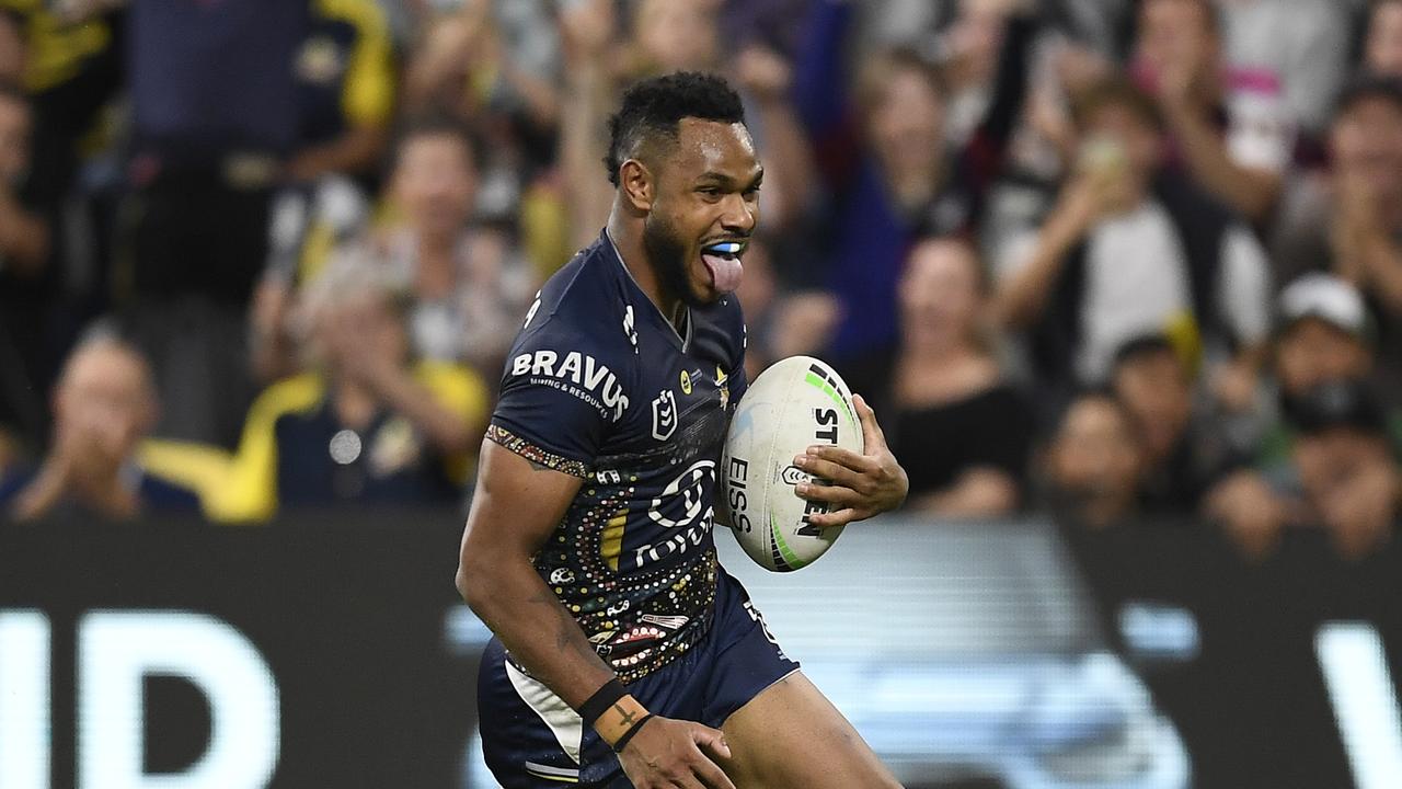 TOWNSVILLE, AUSTRALIA – MAY 28: Hamiso Tabuai-Fidow of the Cowboys runs to score a try during the round 12 NRL match between the North Queensland Cowboys and the New Zealand Warriors at QCB Stadium, on May 28, 2021, in Townsville, Australia. (Photo by Ian Hitchcock/Getty Images)