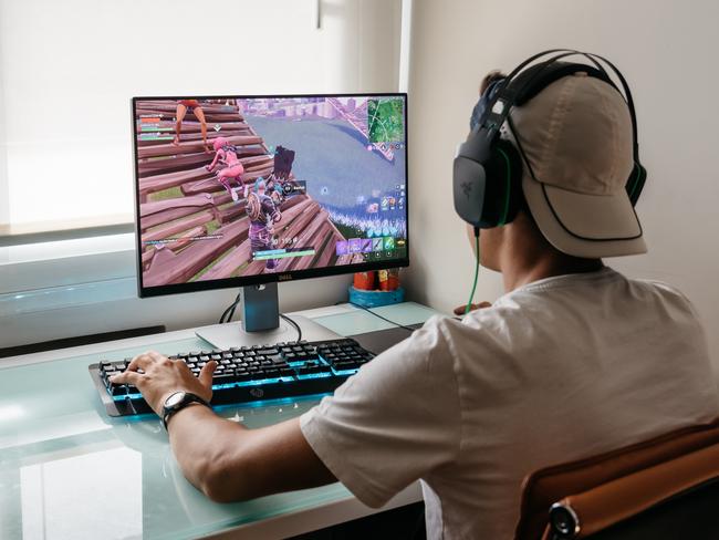 Madrid, Spain - August 15, 2018: Teenager playing Fortnite video game on PC. Fortnite is an online multiplayer video game developed by Epic Games ISTOCK IMAGE