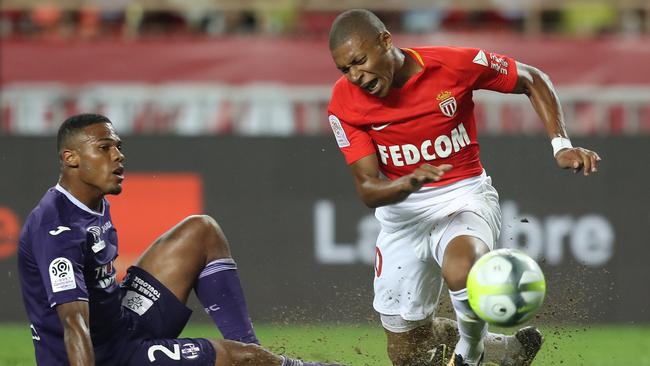 Monaco's French forward Kylian Mbappe (R) vies with Toulouse's French defender Kelvin Amian.