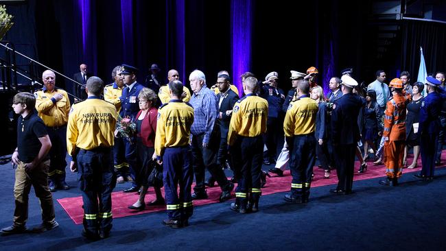 Grieving family members walk through the guard of honour. Picture: Bianca De Marchi/AAP