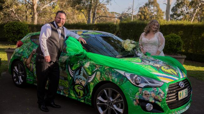 Sue Washington graciously loaned her Raiders decaled Hyundai to newlyweds and Raiders tragics Dan and Jacqui Hewitt. Picture: Callum Thurgar.