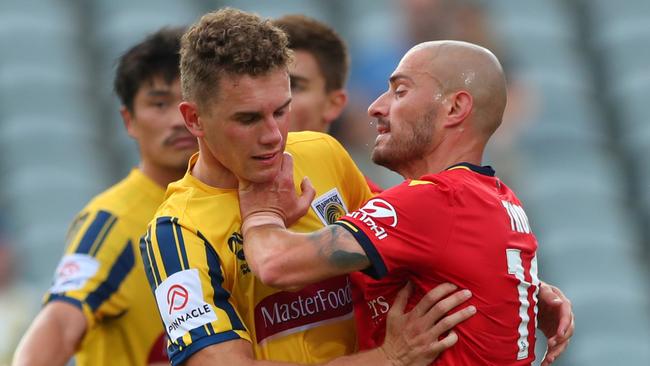 James Troisi of Adelaide United and Gianni Stensness of the Central Coast Mariners clash earlier this season. Picture: Tony Feder/Getty Images.