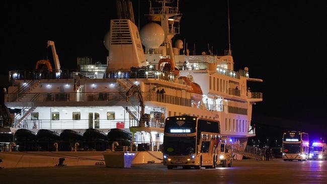 Passengers of the Australian cruise ship the Greg Mortimer are transported to the international airport in Montevideo, Uruguay, for repatriation to Australia.