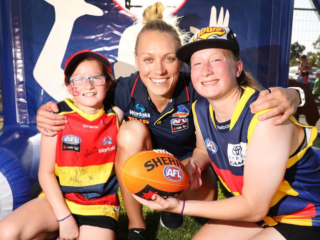 CROWS FAN FAIR FUN - At Wayville show ground, the Adelaide Crows put on a fun day for their fans. Crows star Erin Phillips with young fans, Leah Speck,11,(L), and her sister Tamsyn Speck,14. 22 January 2019. Picture Dean Martin