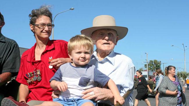 Military Medal recipient and decorated World War II veteran Neville Hewitt with his great grandson Henry Houton in the Rockhampton Anzac Day march this morning. Photo Amber Hooker / The Morning Bulletin. Picture: Amber Hooker