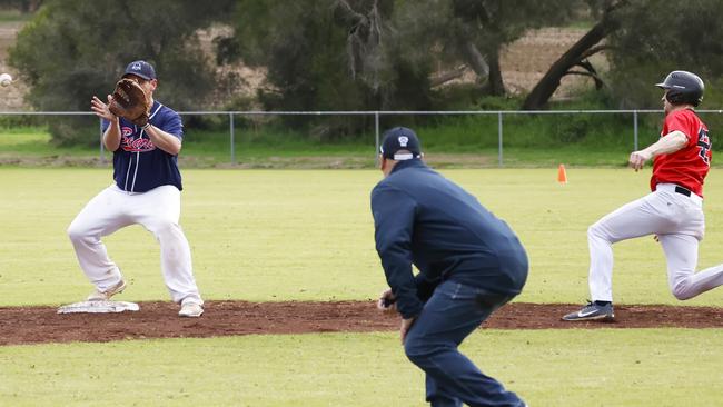 East Belmont Saints coach Cameron Brown slides into second base. Picture: Mark Lazarus.