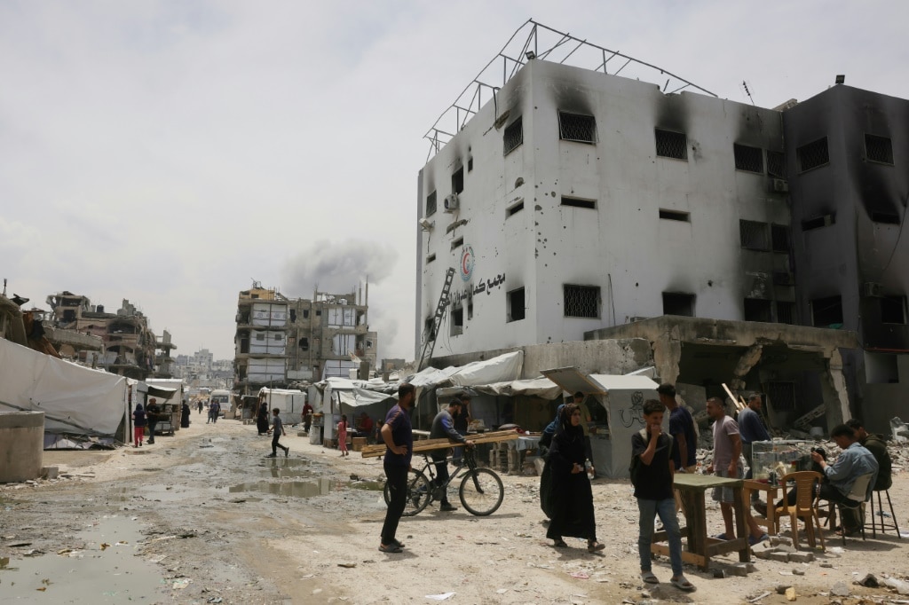 Gaza air strikes kill 94 as manhunt unfolds in West Bank