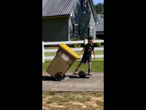 Kid shows off the best hack for bringing the bins in