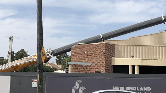 SafeWork NSW has launched an investigation after a crane crashed down on top of Wollongong Builders Club on November 25. Picture: Madeline Crittenden.     