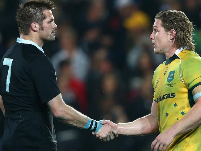 AUCKLAND, NEW ZEALAND - AUGUST 23: All Blacks captain Richie McCaw shakes hands with Wallabies captain Michael Hooper after winning The Rugby Championship match between the New Zealand All Blacks and the Australian Wallabies at Eden Park on August 23, 2014 in Auckland, New Zealand. (Photo by Cameron Spencer/Getty Images)