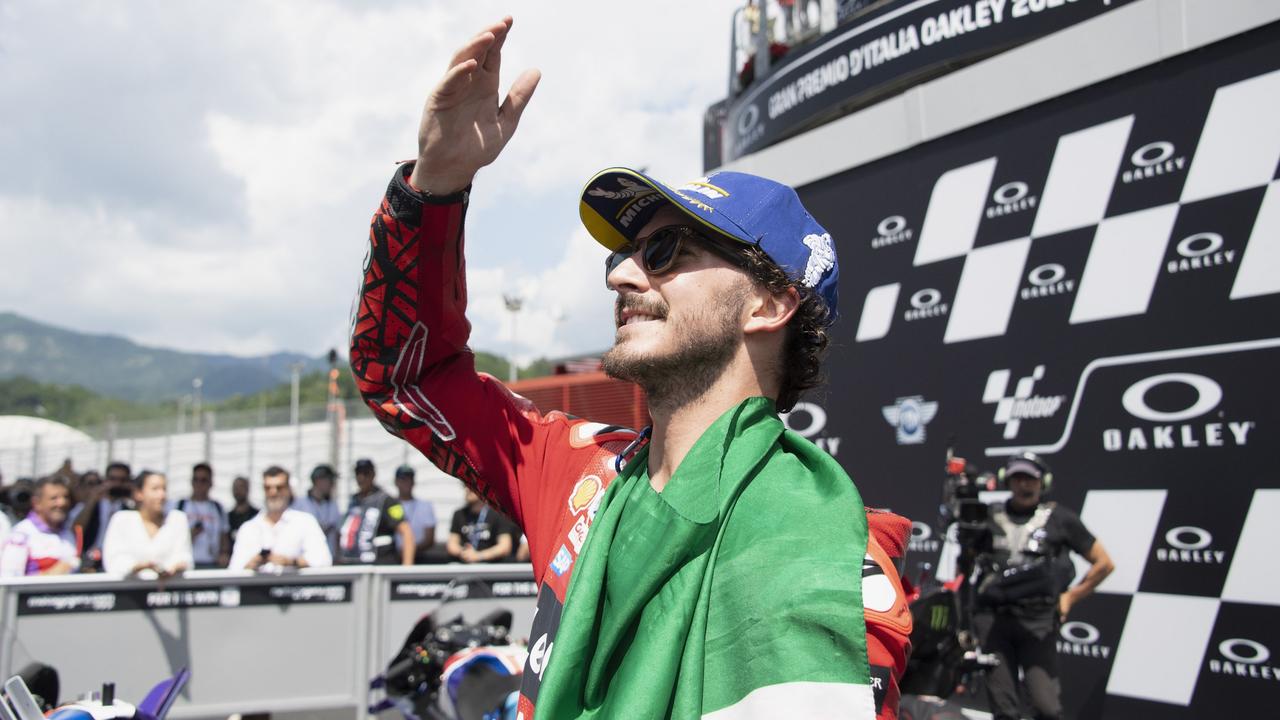 Francesco Bagnaia laps it up after winning the Italian MotoGP. (Photo by Mirco Lazzari gp/Getty Images)