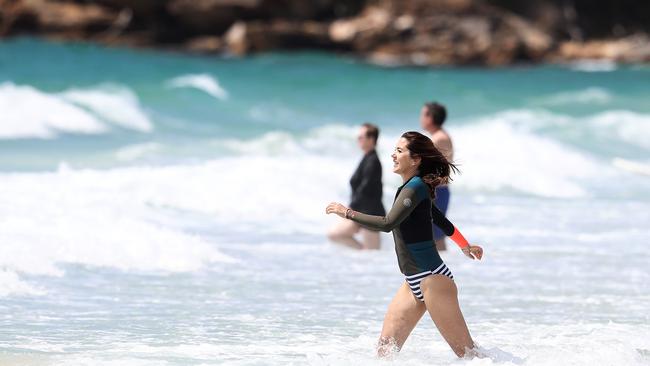 Princess Mary in the surf at Orford, Tasmania, yesterday. Picture: Luke Bowden