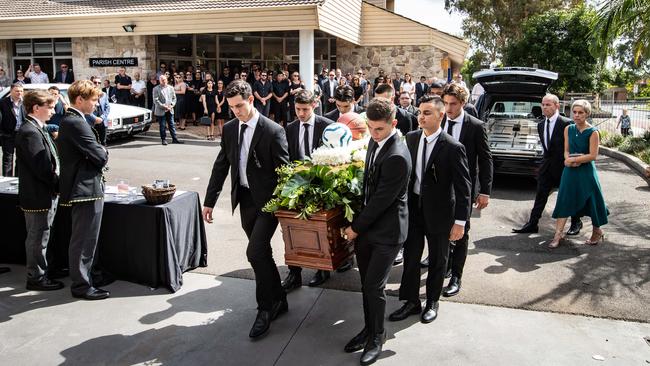 His brothers and best mates carried the coffin into the church. Picture: Julian Andrews.