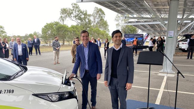 Energy Minister Dr Anthony Lynham and Bundamba MP Lance McCallum charge a car at the Goodna Technology Park.