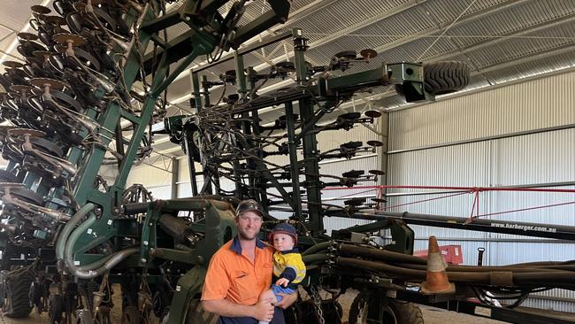 Dan Fox of Marrar and son Hugo, 18 months, with the XL stubble warrior disc seeder. Picture: Nikki Reynolds