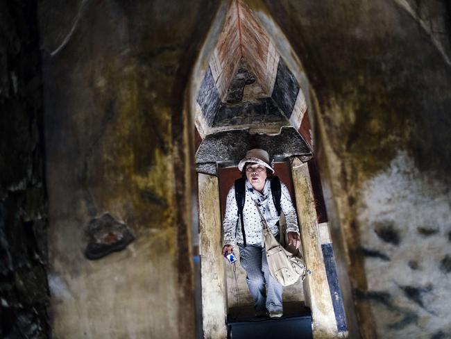 A tourist looks at a replica of the Thracian tomb of Kazanlak.