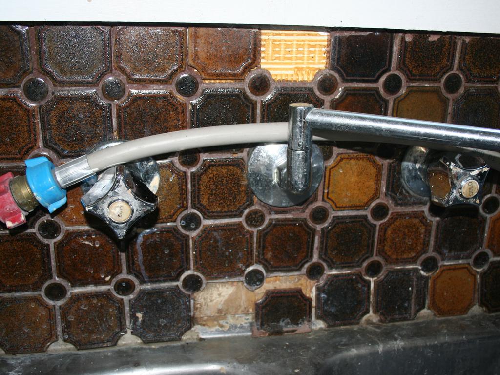 Asbestos can be found under tiles. Picture: Asbestos Awareness.